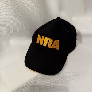 NRA cap with embroidered letters on front and embroidered flag on back.